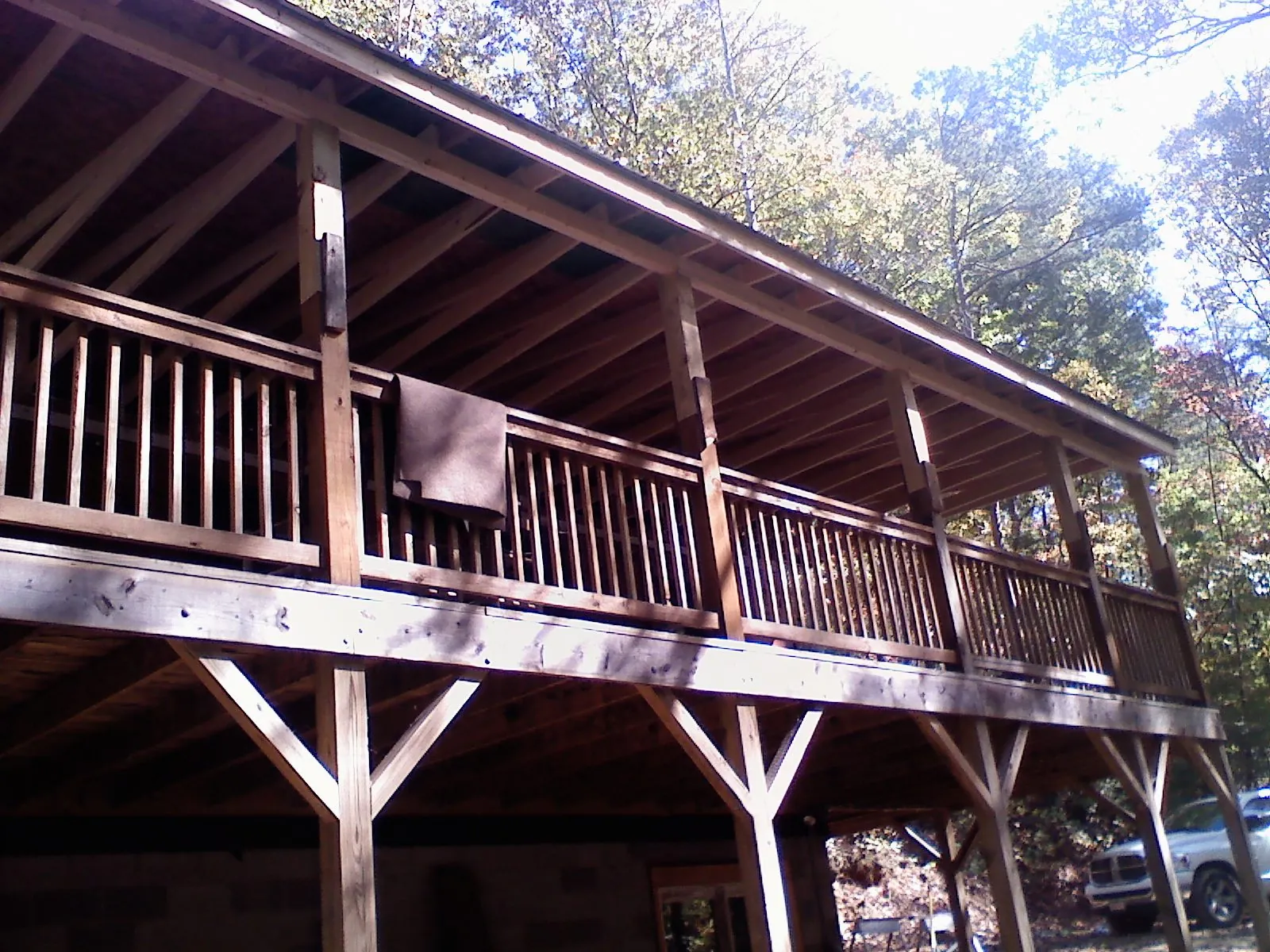 Timber framing under a new elevated porch and deck — Roof Leak Repair in Rollins by Roofing Brothers